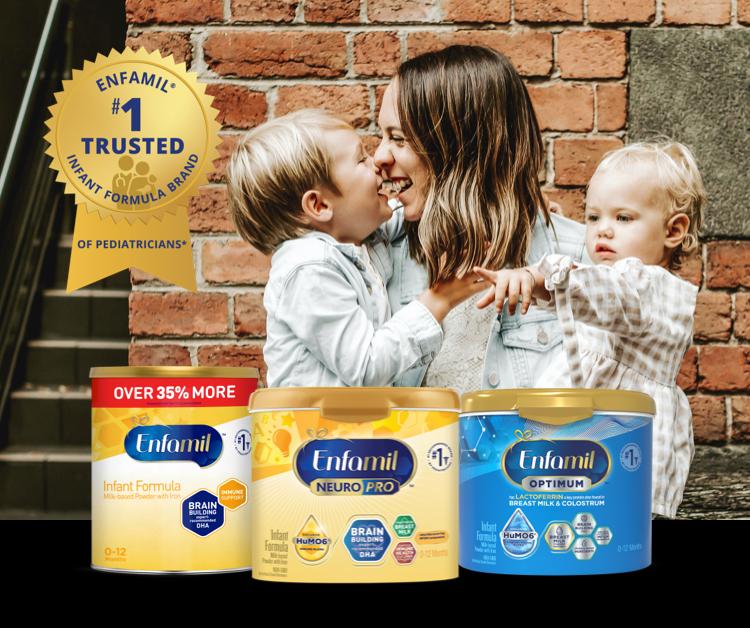 Happy mom with two children with Enfamil product lineup that is #1 Trusted Brand of Pediatricians*