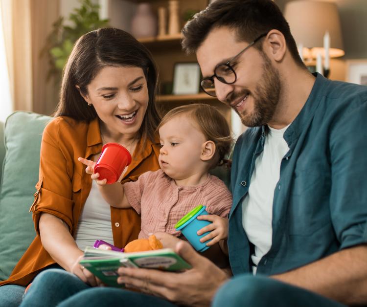 Mother and father playing with baby