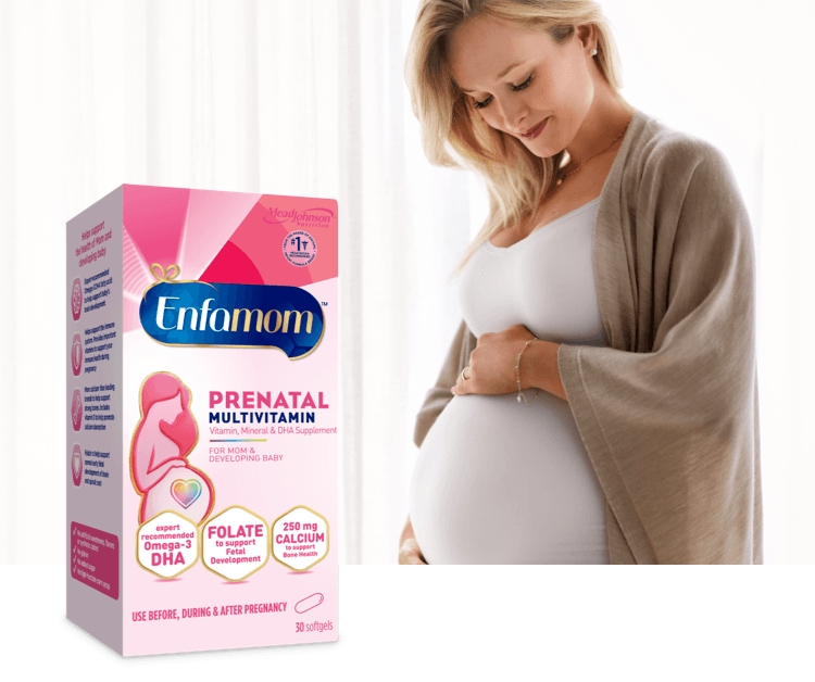 Pregnant woman taking an Enfamom Prenatal Multivitamin