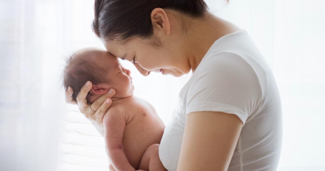 Mom holding baby on her chest