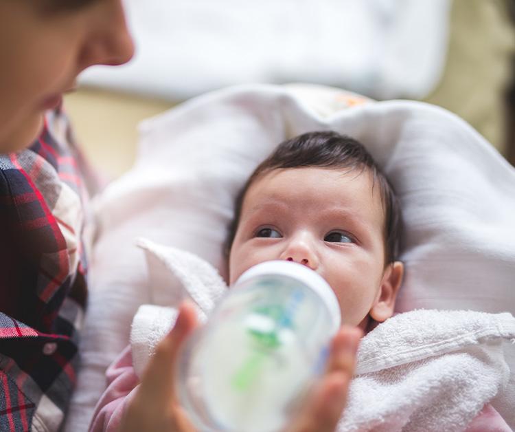 Mom Bottle Feeding Baby