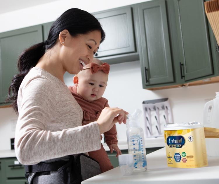 Mom reading a book to her baby