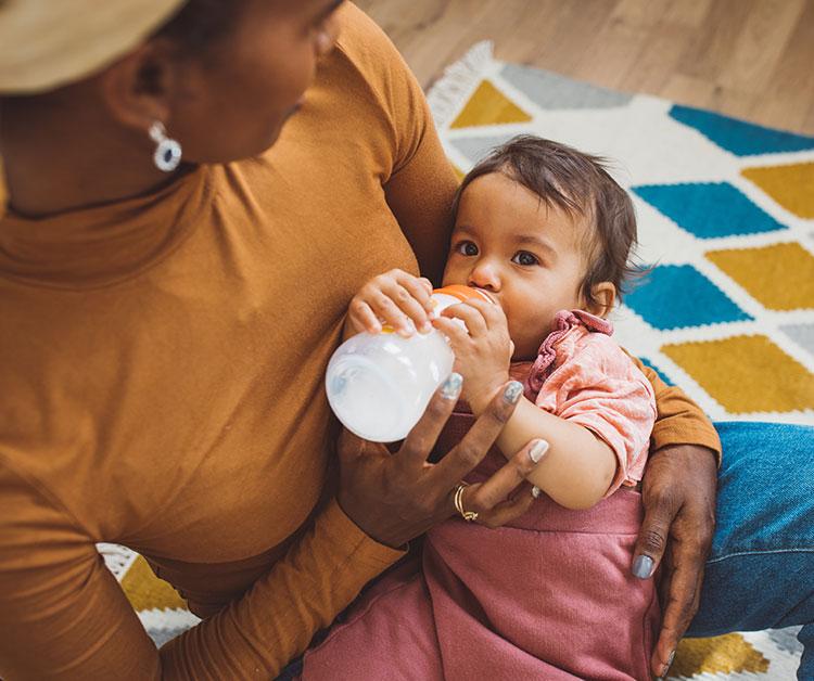 Mom feeding baby a bottle