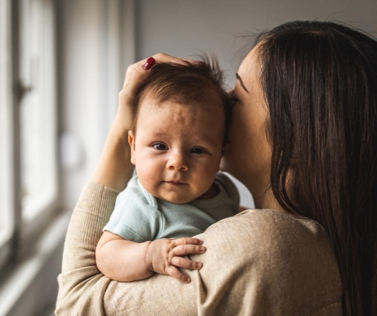 Mom holding baby against her chest