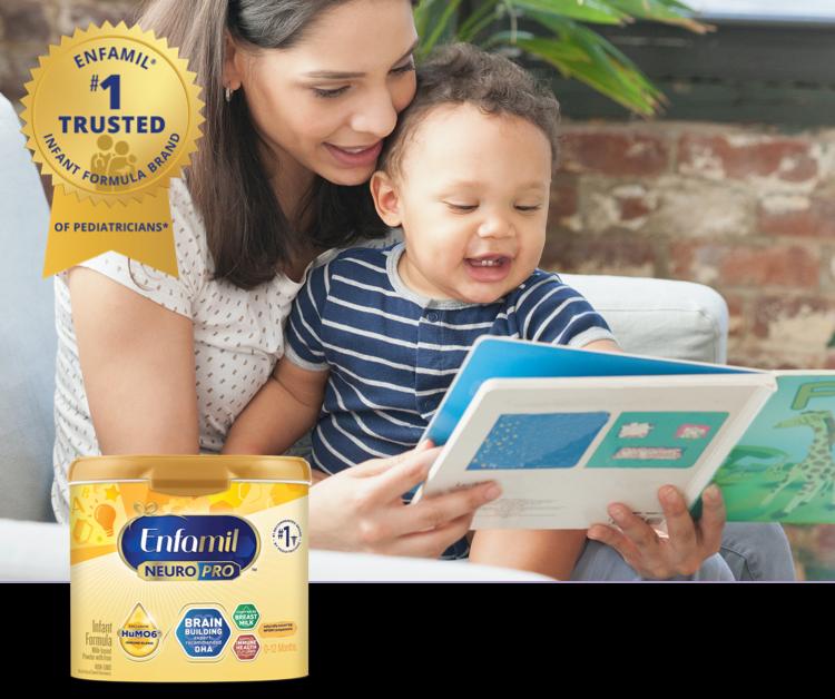 Mom reading a book to her baby