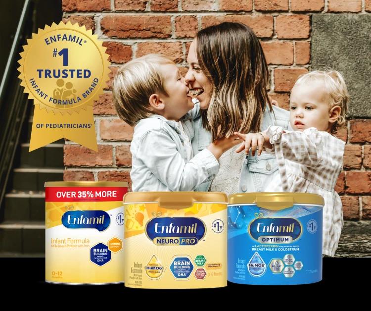 Happy mom with two children with Enfamil product lineup that is #1 Trusted Brand of Pediatricians*