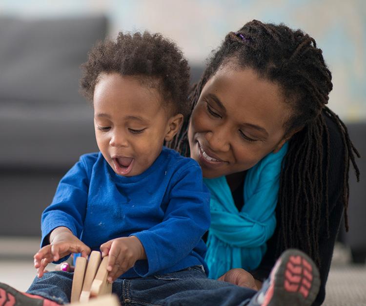 Mom and toddler playing on the floor