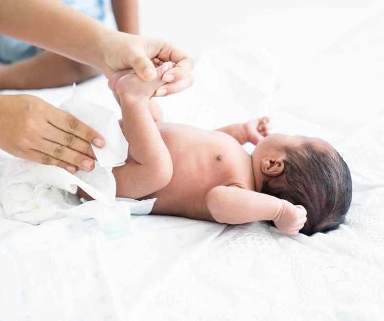 Newborn baby getting a diaper change