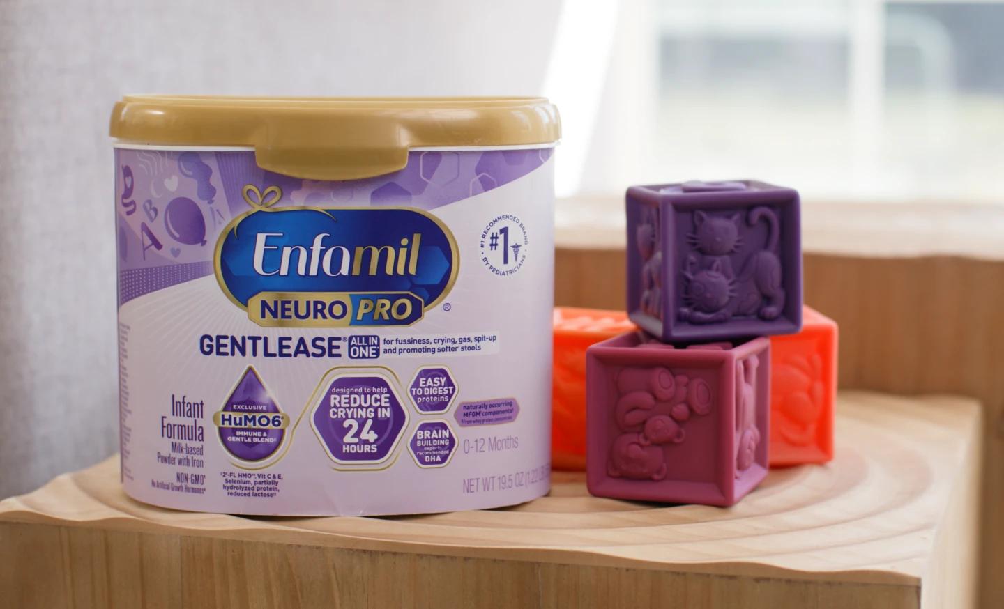 Tub of Enfamil NeuroPro Gentlease sitting next to colorful blocks.