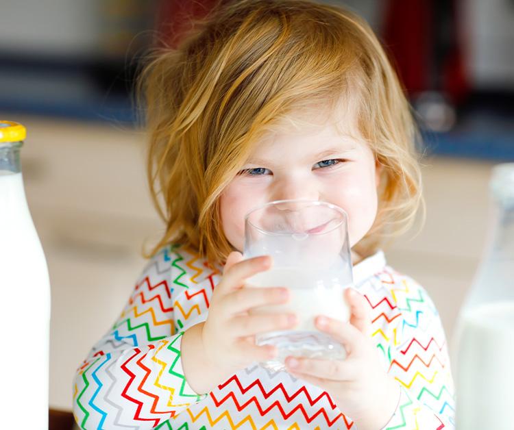 Girl drinking a glass of milk