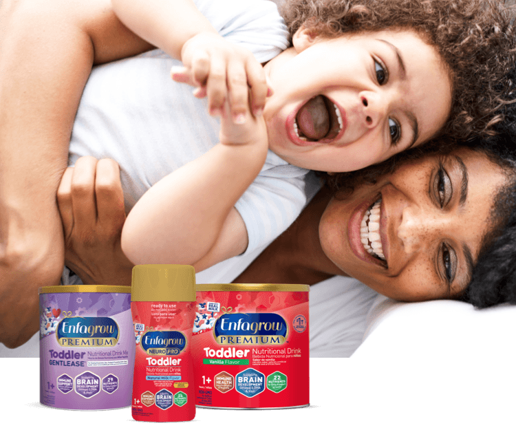 Laughing mom and toddler with a lineup of toddler nutritional drinks