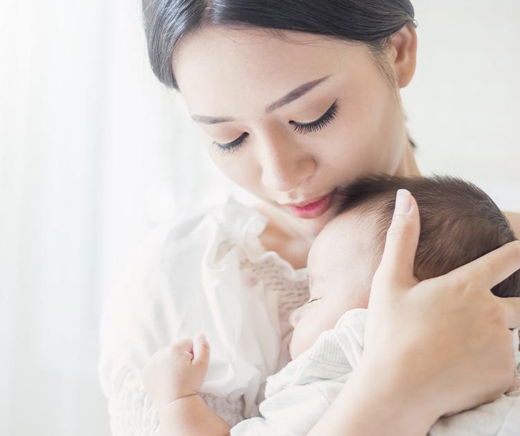 New mom holding her baby close