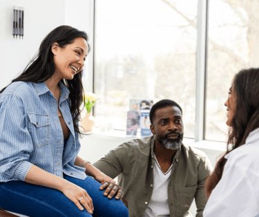 Mother and father talking with the doctor.