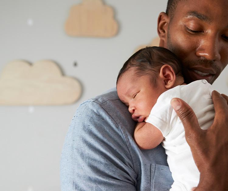 Dad holding his baby