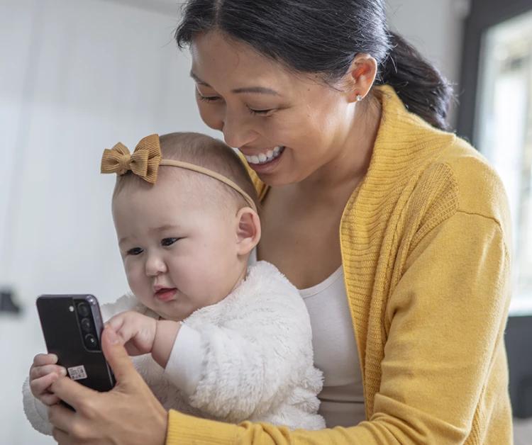 Mom laughing with her baby